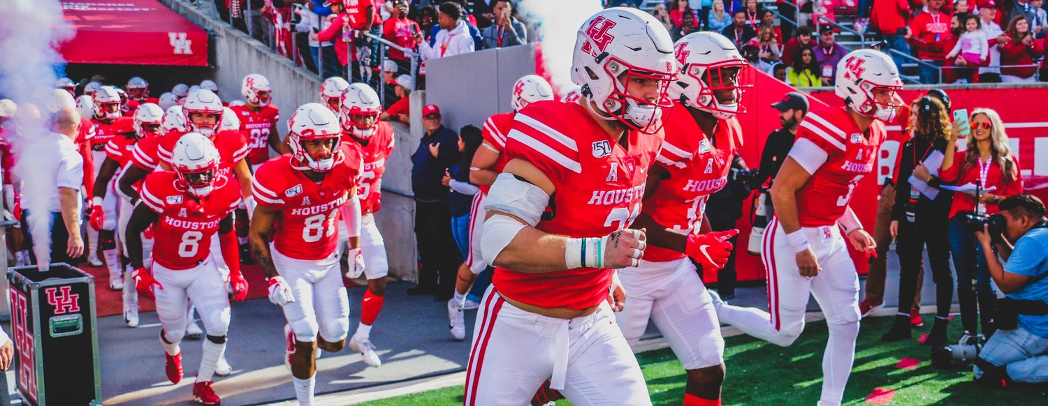 Houston players take the field for a game last season